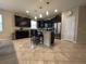 Modern kitchen featuring stainless steel appliances, granite countertops, and a breakfast bar at 2436 Gratia Pl, Casselberry, FL 32707