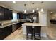 A spacious kitchen with stainless steel appliances and a granite-topped island at 2436 Gratia Pl, Casselberry, FL 32707