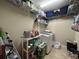 Image of the laundry room featuring washer and dryer, shelves, and cleaning products at 2436 Gratia Pl, Casselberry, FL 32707