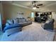 Spacious living room with plush carpeting, ceiling fan, and an open floor plan at 2436 Gratia Pl, Casselberry, FL 32707