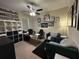 Well-lit home office with ample workspace and comfortable seating at 2436 Gratia Pl, Casselberry, FL 32707