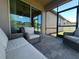 Outdoor patio with wicker chairs and sliding glass doors at 2436 Gratia Pl, Casselberry, FL 32707
