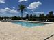 Community swimming pool features clear water, brick paver deck, lounge chairs, and manicured landscaping at 2436 Gratia Pl, Casselberry, FL 32707