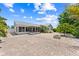 Spacious brick patio with fire pit and mature landscaping, ideal for outdoor entertaining at 2637 Debany Rd, Kissimmee, FL 34744