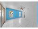 Bedroom with tile floors, ceiling fan and sliding glass door access to lanai at 2637 Debany Rd, Kissimmee, FL 34744