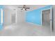 Bedroom featuring tile floors, ceiling fan, and views into hallway and kitchen at 2637 Debany Rd, Kissimmee, FL 34744