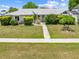 Charming single-story home with a well-maintained lawn and inviting walkway at 2637 Debany Rd, Kissimmee, FL 34744