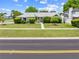 Well-maintained single-story home featuring lush landscaping and a manicured lawn at 2637 Debany Rd, Kissimmee, FL 34744
