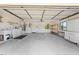 Spacious garage with laundry hookups, utility sink, overhead door and ample room for storage and projects at 2637 Debany Rd, Kissimmee, FL 34744