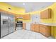 Bright kitchen features wooden cabinets and stainless steel appliances at 2637 Debany Rd, Kissimmee, FL 34744