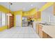 Bright kitchen with stainless steel appliances, tile floors, and wooden cabinets at 2637 Debany Rd, Kissimmee, FL 34744