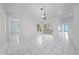 The living room has tile floors, a hanging light fixture, and a sliding glass door at 2637 Debany Rd, Kissimmee, FL 34744