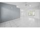 The living room features tile flooring and access to other rooms in the home at 2637 Debany Rd, Kissimmee, FL 34744