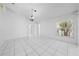 Bright living room offers tile flooring and a hanging light fixture at 2637 Debany Rd, Kissimmee, FL 34744