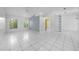 Spacious living room with tile floors, built in shelving, and lots of natural light at 2637 Debany Rd, Kissimmee, FL 34744