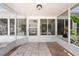 Enclosed patio with tile flooring, offering a relaxing and versatile space for outdoor enjoyment at 2637 Debany Rd, Kissimmee, FL 34744