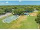 Community park featuring basketball court, playground, picnic shelter, and open green spaces for recreation at 2637 Debany Rd, Kissimmee, FL 34744