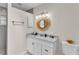 Bright bathroom featuring a modern vanity, decorative mirror, and toilet with tiled flooring at 2727 Easton Ter, Lakeland, FL 33803