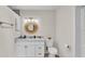 Bright bathroom featuring a modern vanity, decorative mirror, and toilet with tiled flooring at 2727 Easton Ter, Lakeland, FL 33803