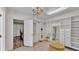 A walk-in closet featuring custom shelves, drawers, and a decorative mirror for added elegance at 2727 Easton Ter, Lakeland, FL 33803
