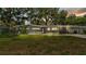 Charming single-story home with updated gray brick accents, a well-manicured lawn, and mature landscaping at 2727 Easton Ter, Lakeland, FL 33803
