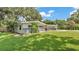 Beautiful single-story home with updated landscaping and a lush green lawn at 2727 Easton Ter, Lakeland, FL 33803