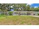 Charming single-story home with a manicured lawn and inviting front entrance at 2727 Easton Ter, Lakeland, FL 33803