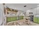 Bright kitchen featuring a large window, tiled floor, butcher block countertop and stainless steel appliances at 2727 Easton Ter, Lakeland, FL 33803