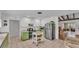 Well-lit kitchen with green cabinets, butcher block counters and stainless steel appliances at 2727 Easton Ter, Lakeland, FL 33803