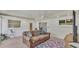 Well-lit living room with tile floors, modern lighting, and a comfortable brown leather sofa at 2727 Easton Ter, Lakeland, FL 33803
