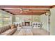 Bright living room featuring a brick fireplace, ceiling fan, and natural light at 2727 Easton Ter, Lakeland, FL 33803