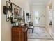 Inviting foyer with decorative rug, elegant lighting fixtures, and a glimpse of the home's interior at 2772 Southland St, St Cloud, FL 34772