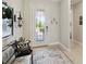 Welcoming foyer with a decorative front door and a glimpse of the home's stylish interior design at 2772 Southland St, St Cloud, FL 34772