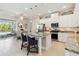 Modern kitchen with granite countertops, stainless steel appliances, and an island with seating at 2772 Southland St, St Cloud, FL 34772