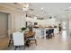 Bright kitchen with a central island, stainless steel appliances, and a dining area at 2772 Southland St, St Cloud, FL 34772