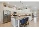 Well-lit kitchen featuring an island, stainless steel appliances, and white cabinetry at 2772 Southland St, St Cloud, FL 34772