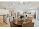 Open living area featuring a modern kitchen, dining space, and cozy seating with a fireplace at 2772 Southland St, St Cloud, FL 34772