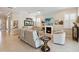 Bright living room with a fireplace, tile floors, comfortable seating, and charming decor at 2772 Southland St, St Cloud, FL 34772