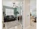 Comfortable office with a ceiling fan, stylish decor, and a cozy seating area at 2772 Southland St, St Cloud, FL 34772