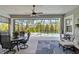 Covered patio features dining area, sitting area, ceiling fan, screened pool and spa at 2772 Southland St, St Cloud, FL 34772