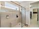 Modern shower with glass enclosure, built-in seat, and niche for storage at 2772 Southland St, St Cloud, FL 34772