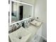 Bathroom with and vessel sinks, quartz countertops, and lighted mirror at 2805 Carter Grove Ln, Kissimmee, FL 34741