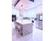 Bright kitchen with stainless steel appliances and large island with bar stools at 2805 Carter Grove Ln, Kissimmee, FL 34741