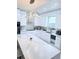 Modern kitchen featuring white cabinets, stainless steel appliances, and a large island at 2805 Carter Grove Ln, Kissimmee, FL 34741