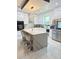 Bright kitchen with stainless steel appliances and large island with bar stools at 2805 Carter Grove Ln, Kissimmee, FL 34741