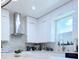 Bright kitchen with stainless steel hood and view of the window at 2805 Carter Grove Ln, Kissimmee, FL 34741