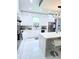Sleek kitchen with white cabinets, stainless steel appliances, and modern finishes at 2805 Carter Grove Ln, Kissimmee, FL 34741