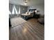 Cozy bedroom with hardwood floors, elegant furnishings, and soft natural light at 293 Fiddlewood Ct, Davenport, FL 33837