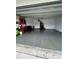 Spacious two-car garage with ample storage space and epoxy flooring at 293 Fiddlewood Ct, Davenport, FL 33837