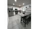 Modern kitchen with stainless steel appliances, granite countertops, and a large island at 293 Fiddlewood Ct, Davenport, FL 33837